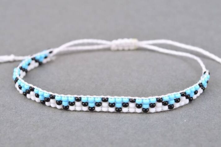 A bracelet of threads and beads is a talisman that will bring good luck to the owner